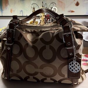 Coach Alexandra handbag with signature Op Art canvas design.  Leather trim.